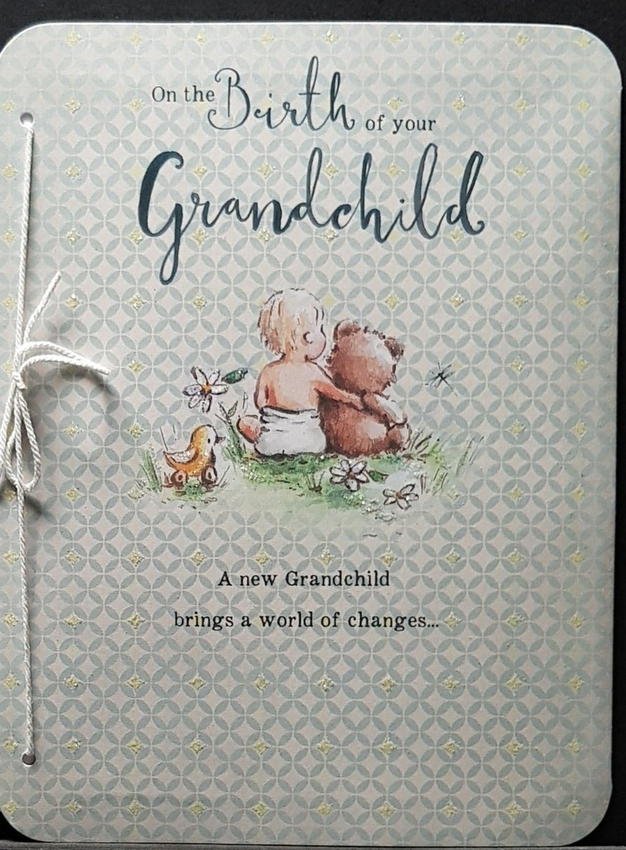 New Baby Card - Grandchild / Baby Hugging Teddy Sitting On The Grass & A White Bow