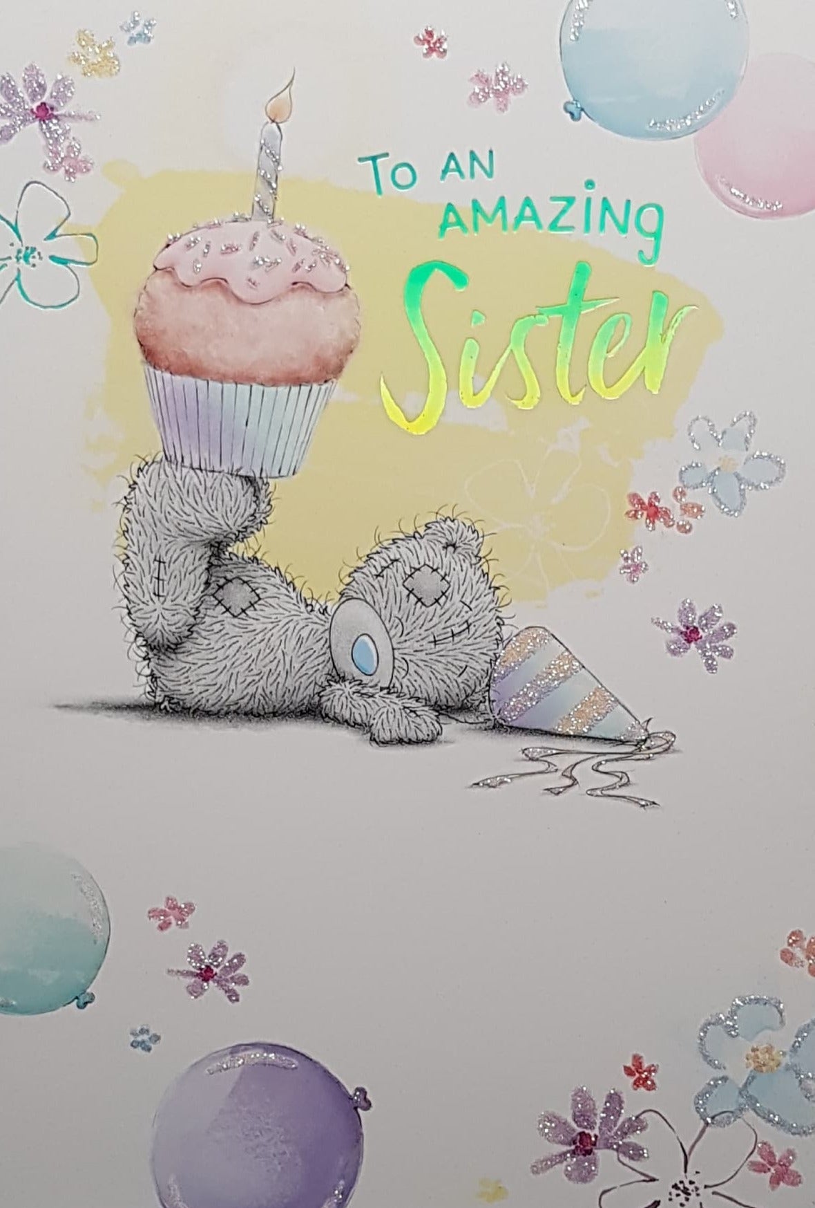 Birthday Card - Sister / Teddy Bear Balancing A Cupcake On Feet Lying Down