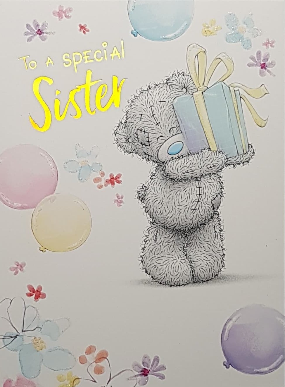 Birthday Card - Sister / Teddy Holding Up A Blue Gift Surrounded By Balloons