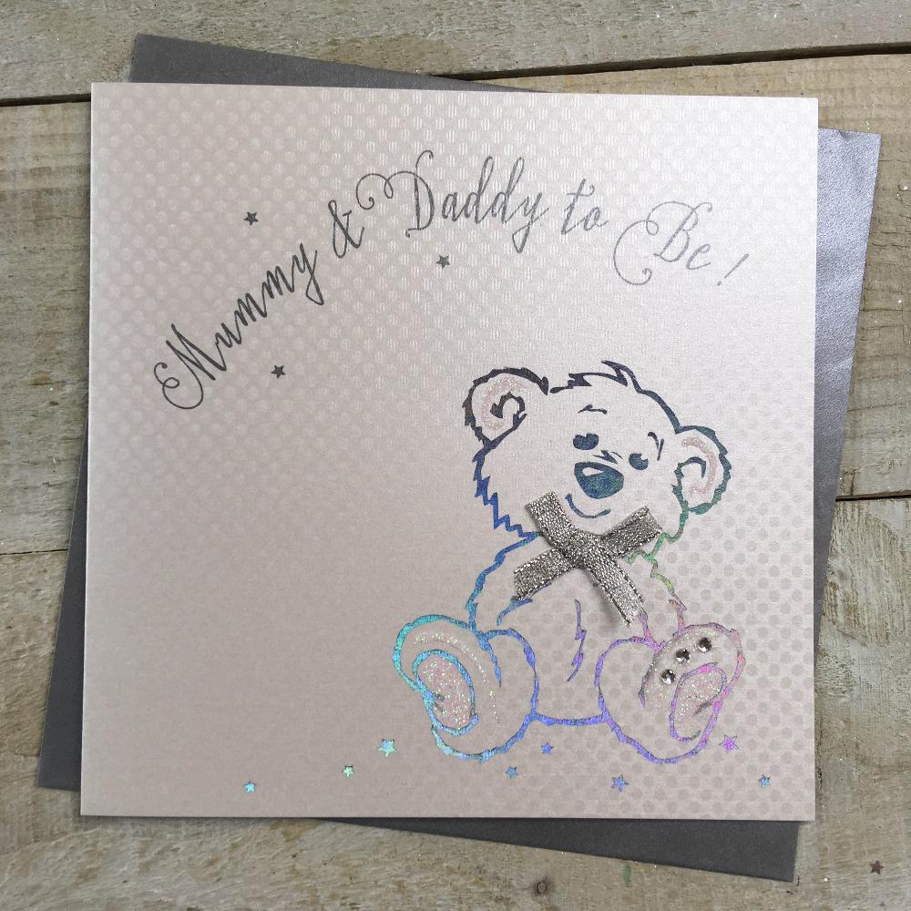 New Baby Card - Mummy & Daddy To Be / A Smiling Teddy With A Silver Bow
