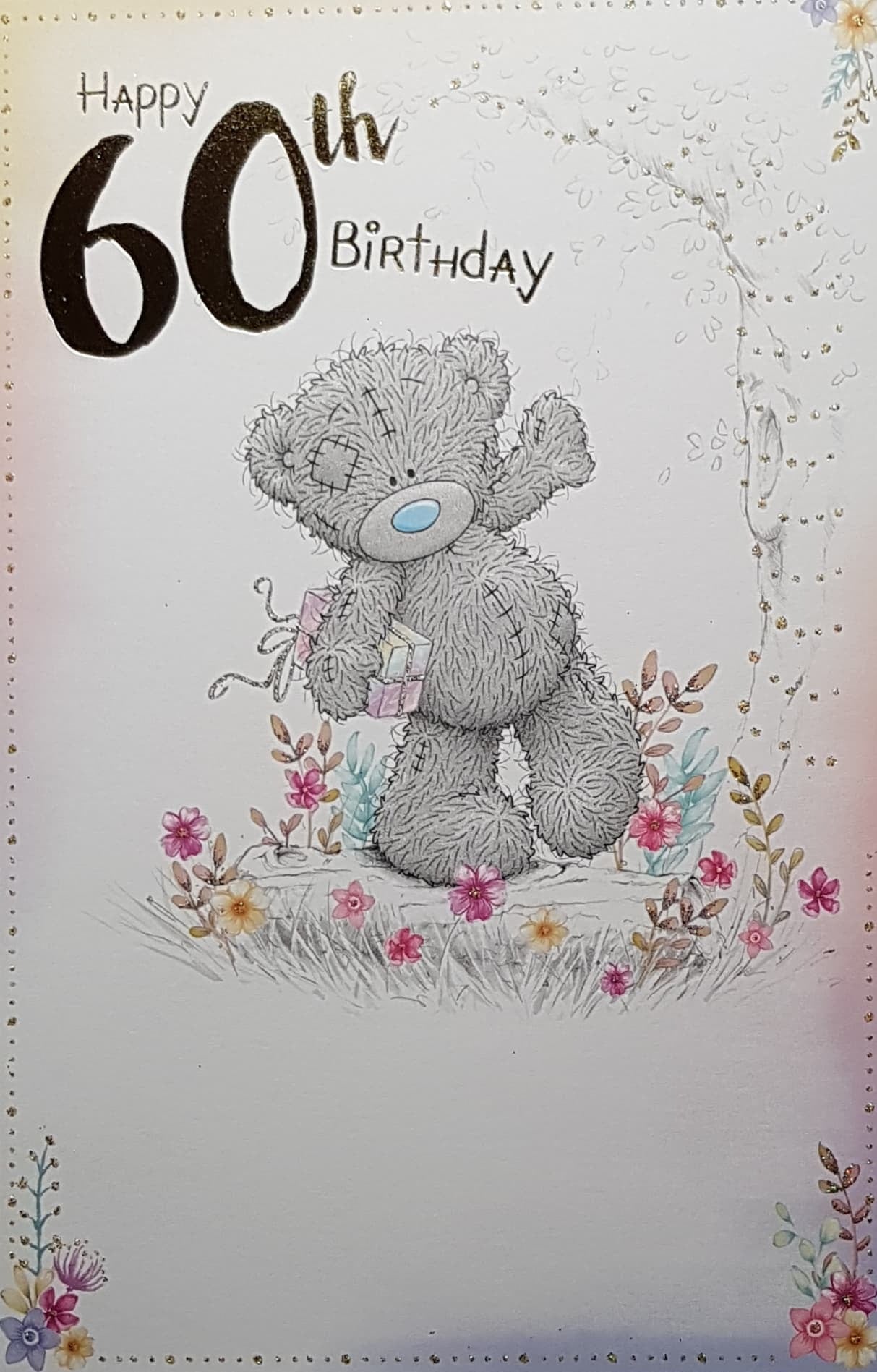 Age 60 Birthday Card - Cute Teddy Stumbling Through A Flower Bed With A Pink Gift